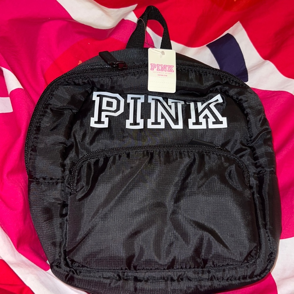 PINK small black mini bookbag.